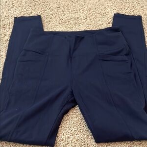 Athleta navy blue medium bettona Leggings Slim Fit Stretch w/ back pockets